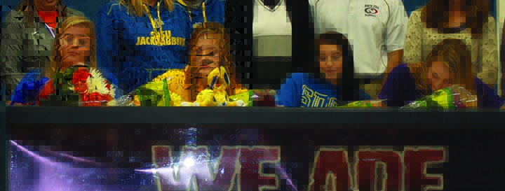Senior softball players Elaina Mayer (from left), Bobbi Singleton, Bailey Bolles, and Ashley Meyer sign their letters of intent on Wednesday, Nov. 11.
Photo by Ethan Wobken/GG Staff