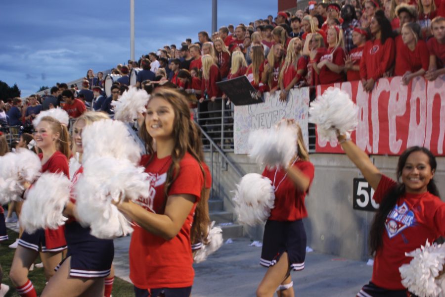 Cheerleaders and the student section get pumped up before game time! 