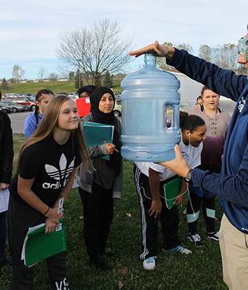 Kirsten Adamson (9), left, views the clouds created by Mr. DeGrands Geoscience experiment on Wednesday, Oct. 25.
Photo by GG Staff