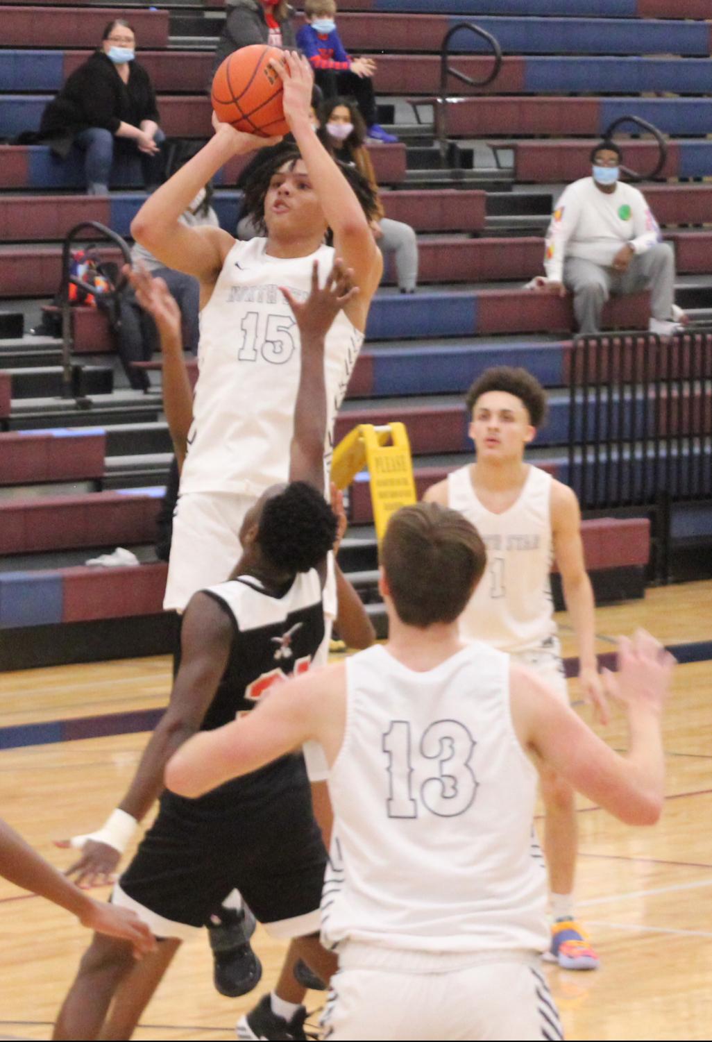 Sophomore Brennon Clemmons, Jr. goes up for a shot during the Gators game against Lincoln High.