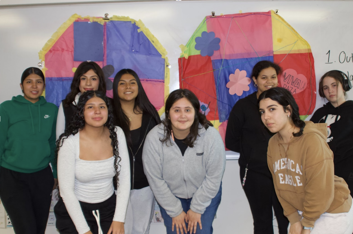 Latino Leaders club members pose together in front of their handmade barilettes which are now hanging in the Spanish for Spanish Speakers, Ms.Ruiz’s, classroom.