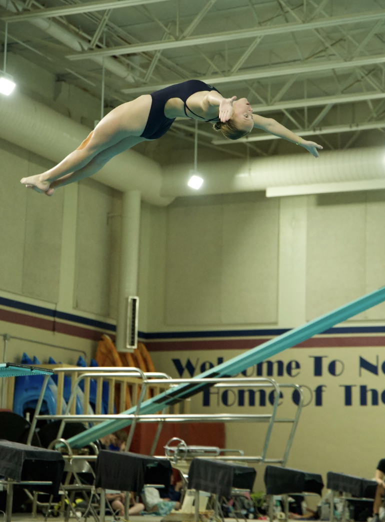 Pride of North Star Dive, Carly Beals (11) jumps with pride as she looks to get a top score at the North Star Dive Meet. She would then go on to place top first at her home event. 