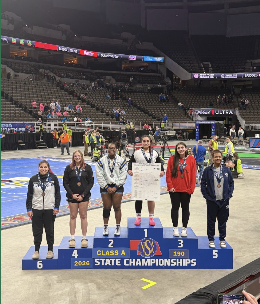 Standing proudly on the podium, Anderson smiles after claiming fifth place. Anderson started the year on the JV team but by the end claimed the highest honor of the whole program.
