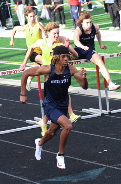Junior Le'Brian Clay runs in the 110m hurdles at the Millard South Track Invite. He would end up running a 15.10, ultimately winning the Invite.
